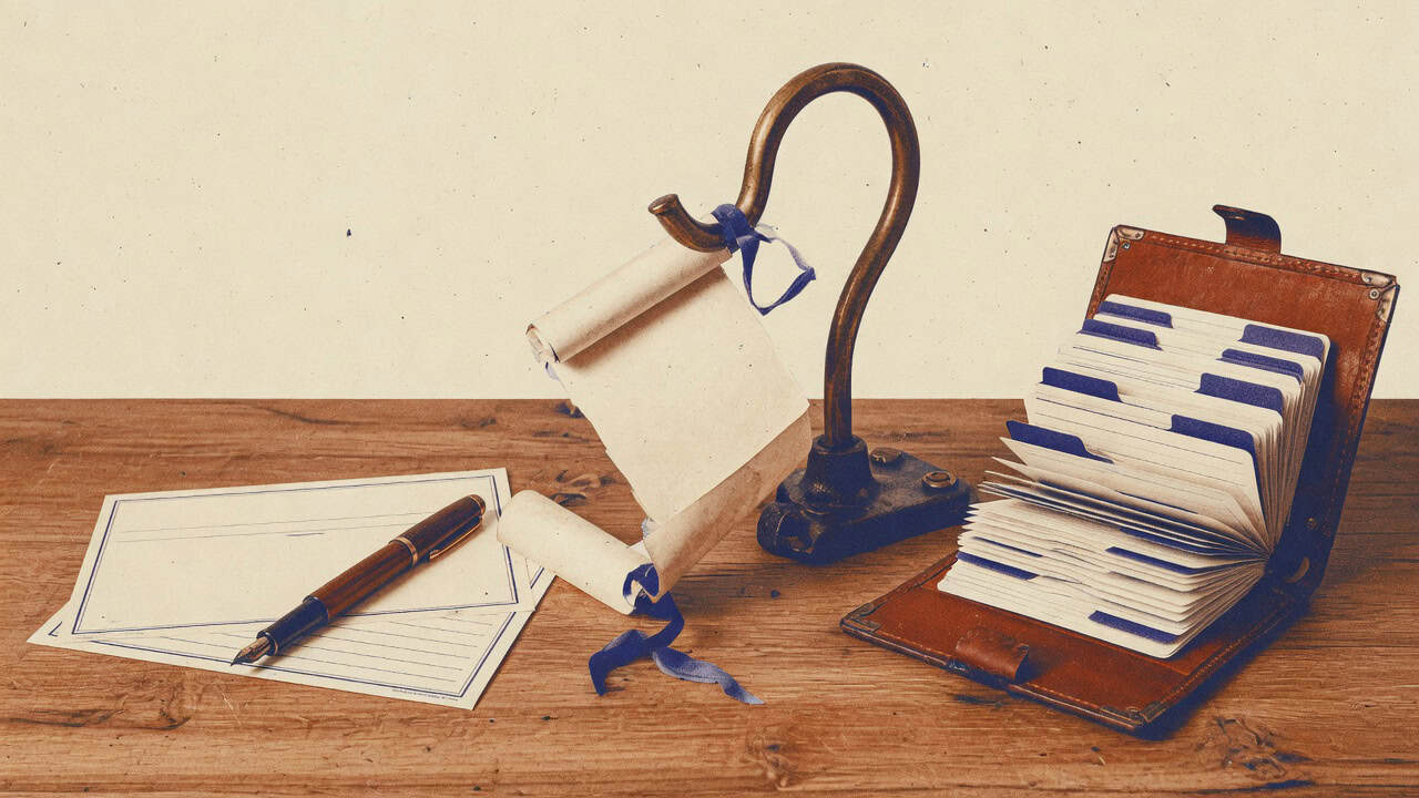 Vintage still life of a registration card and fountain pen, a brass hook catching a rolled paper message, and an open leather card-file on a wooden desk.